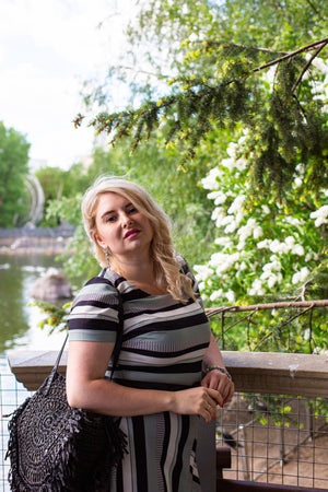 beautiful-young-woman-enjoying-smell-lilac-blossom-garden.jpg